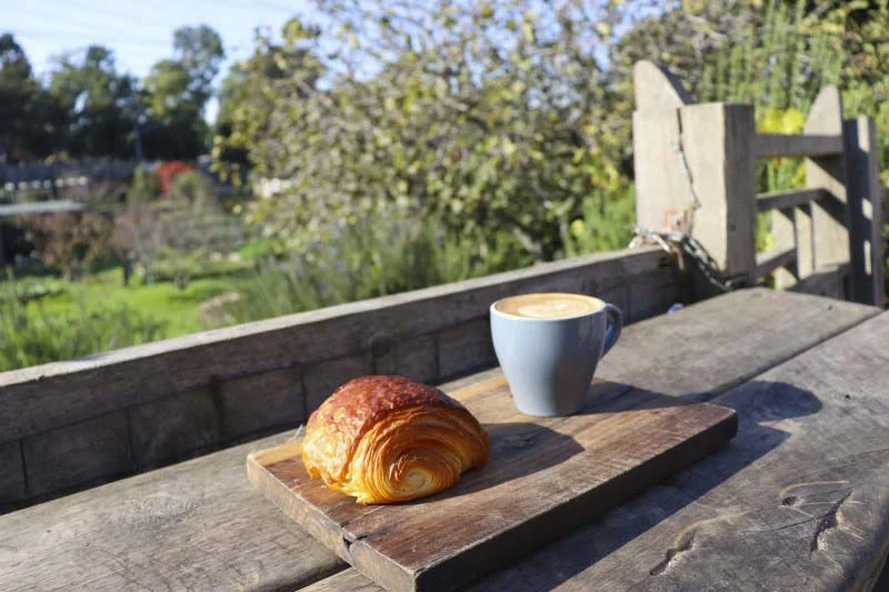 Croissant and coffee in the sun