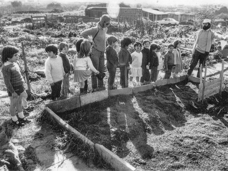 Old photo, black and white, children learning gardening